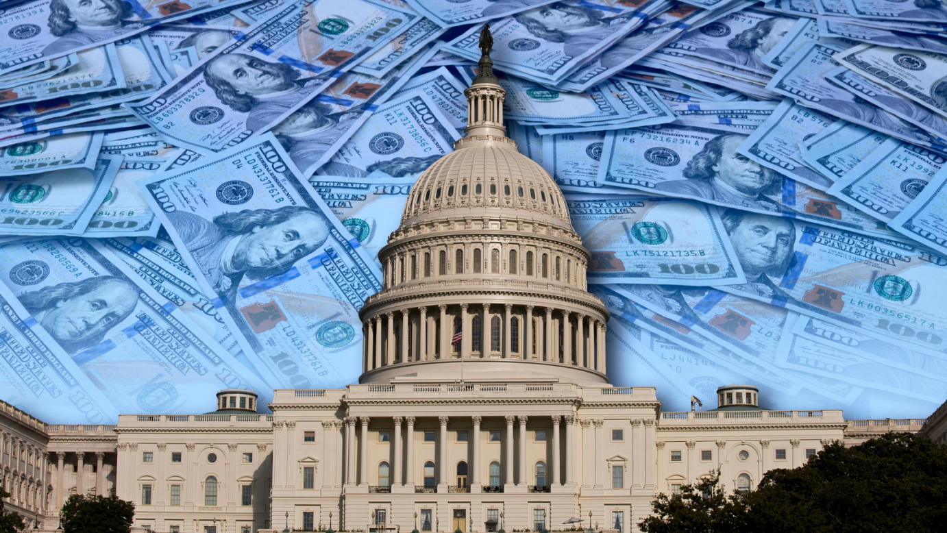 U.S. Capitol building with $100 bills added to the  background behind the building.